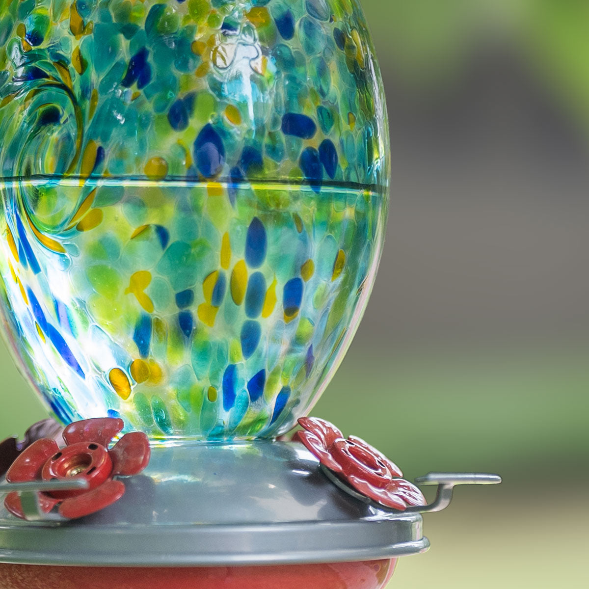 Hand blown glass hummingbird feeder, selling 27 ounce